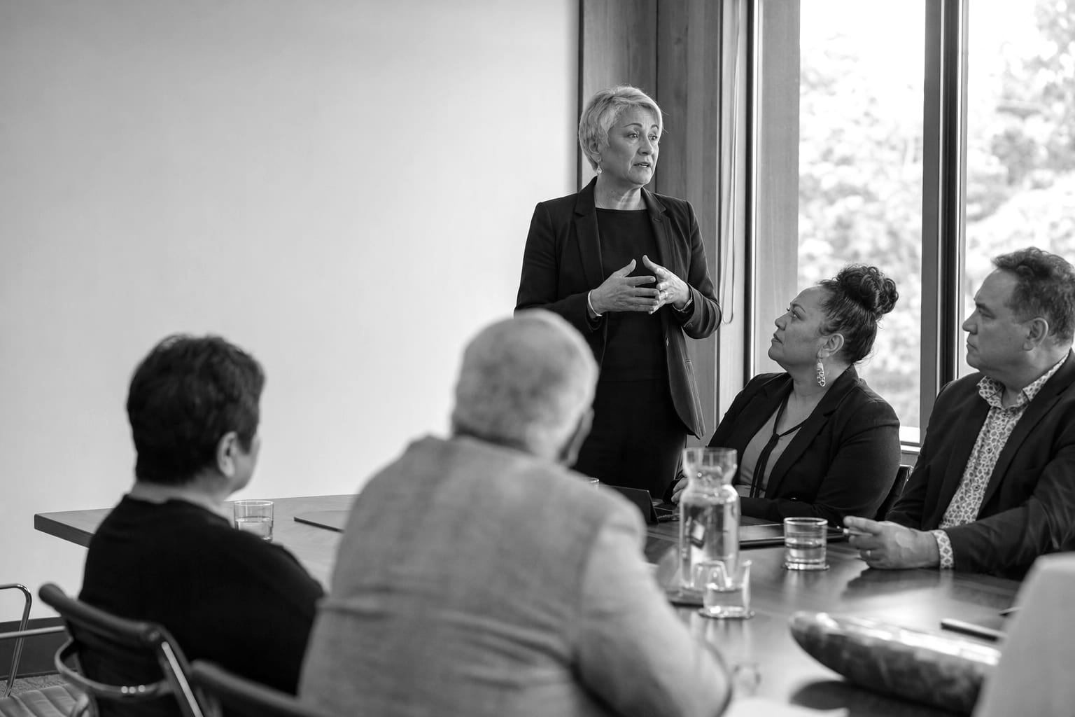 A senior technology executive presenting to a boardroom