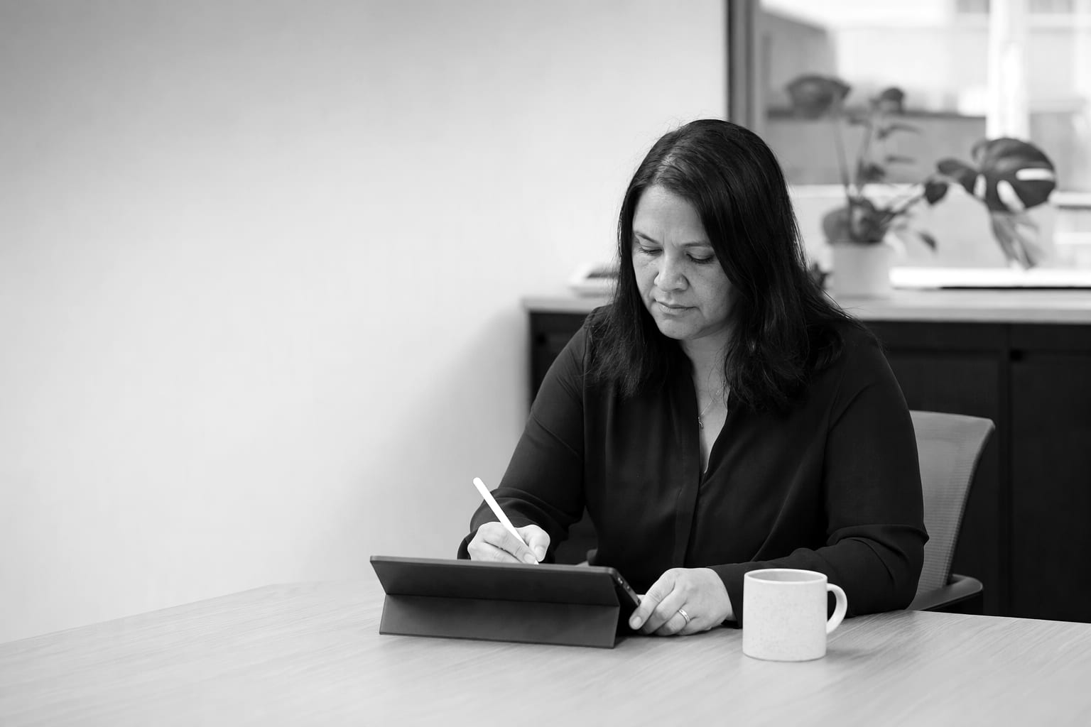 A manager reviewing results on a tablet